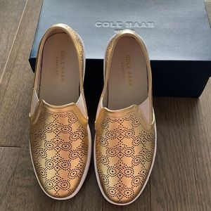 Brand New! Gold Cole Haan Slip on sneakers